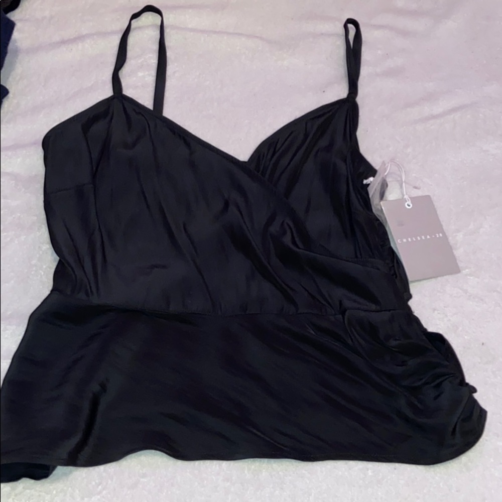 Black spaghetti strap shirt.